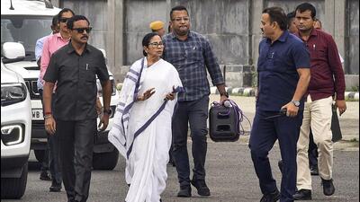 West Bengal chief minister Mamata Banerjee arrives at Netaji Subhash Chandra Bose International Airport in Kolkata on Monday while en route to flood-hit North Bengal. (PTI) West Bengal chief minister Mamata Banerjee arrives at Netaji Subhash Chandra Bose International Airport in Kolkata on Monday while en route to flood-hit North Bengal. (PTI)