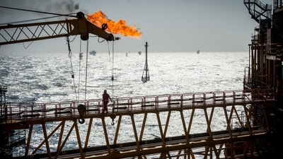 A gas flare burns from a pipe on an offshore oil platform in the Persian Gulf. (WSJ) A gas flare burns from a pipe on an offshore oil platform in the Persian Gulf. (WSJ)