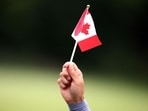 A person holds a Canada flag in Mississauga, Canada. (AFP) A person holds a Canada flag in Mississauga, Canada. (AFP)