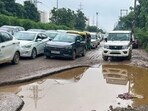 The pothole-filled stretch on Golf course extension road. (HT) The pothole-filled stretch on Golf course extension road. (HT)