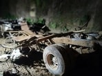 Wrecked remains of a private bus, which was hit by a landslide at the Balurghat area in the Jhandhuta subdivision, in Bilaspur on Tuesday. 