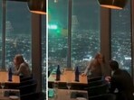 Man proposes to girlfriend with helicopter flying outside window at LA restaurant (@CollinRugg/X) Man proposes to girlfriend with helicopter flying outside window at LA restaurant (@CollinRugg/X)