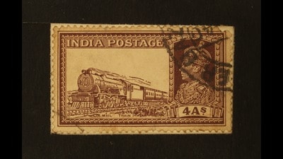 A commemorative postal stamp of British India depicting King George V and a mail train. Pious Labor by Amanda Lanzillo quotes from Kalid-i-san‘at ( The Key to Industry , 1890) by Hakimuddin, who worked at the North Western State Railway Locomotive Department at Sukkur (Sindh). He refers to the “train of endless progress”. (Shutterstock) A commemorative postal stamp of British India depicting King George V and a mail train. Pious Labor by Amanda Lanzillo quotes from Kalid-i-san‘at ( The Key to Industry , 1890) by Hakimuddin, who worked at the North Western State Railway Locomotive Department at Sukkur (Sindh). He refers to the “train of endless progress”. (Shutterstock)