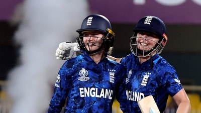 Heather Knight, right, and Charlie Dean celebrate after winning the ICC Women's World Cup cricket match between Bangladesh and England (PTI) Heather Knight, right, and Charlie Dean celebrate after winning the ICC Women's World Cup cricket match between Bangladesh and England (PTI)