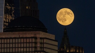The first supermoon of the year, known as the Harvest Moon, rises above lower Manhattan. (REUTERS)