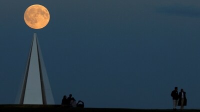 The year's first supermoon appears above the Light Pyramid in Campbell Park, Milton Keynes in Britain. (Peter Cziborra/REUTERS)