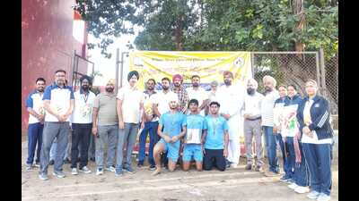 Winners of the volleyball finals in the Under-19 boys category at the 69th Punjab State Inter-District School Games in Ludhiana on Tuesday. (HT Photo)