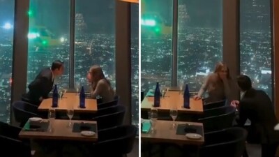Man proposes to girlfriend with helicopter flying outside window at LA restaurant (@CollinRugg/X) Man proposes to girlfriend with helicopter flying outside window at LA restaurant (@CollinRugg/X)