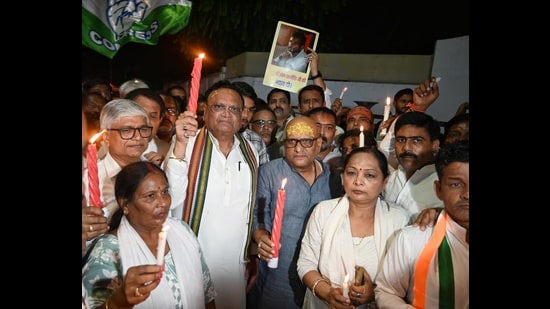 UP Congress president Ajay Rai and other party workers take out a candle march in Lucknow on Tuesday (Mushtaq Ali/HT)