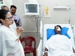 WB CM Mamata Banerjee met BJP MP Khagen Murmu who was injured in attack during his visit to flood-affected areas. (ANI photo)