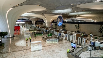 With a cost of around  <span class='webrupee'>₹</span>19,650 crore for Phase-1, the interiors of the newly-built NMIA have lotus designs that give the airport a unique look with futuristic architectural form. (ANI)