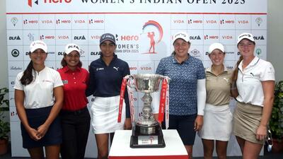 Golfers pose together. (HT)