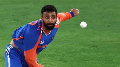 India's Varun Chakravarthy bowls during the Asia Cup 2025 final Twenty20 against Pakistan. (AFP)