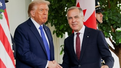 US President Donald Trump welcomes Canada's Prime Minister Mark Carney at the White House on October 7. (Evelyn Hockstein/REUTERS)