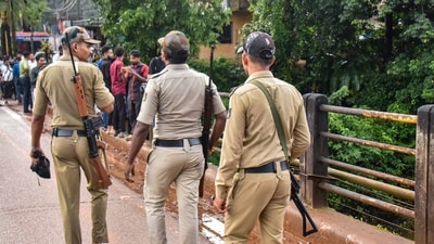 Security personnel keep vigil during examination by a Special Investigation Team (SIT) in the Dharmasthala mass burial case, (PTI/File) Security personnel keep vigil during examination by a Special Investigation Team (SIT) in the Dharmasthala mass burial case, (PTI/File)