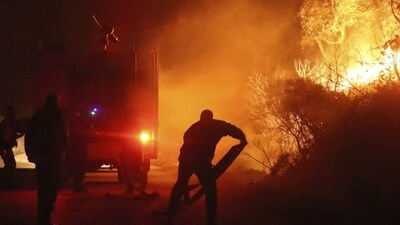 As workers attempted to contain the fires, over 200,000 people were at one time under evacuation orders. (REUTERS)