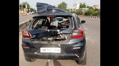 The mangled remains of the car that rammed into a parked truck on Wednesday (HT Photo) The mangled remains of the car that rammed into a parked truck on Wednesday (HT Photo)