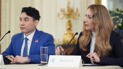 Brandi Kruse and Andy Ngo listens at the White House on Wednesday. (AP) Brandi Kruse and Andy Ngo listens at the White House on Wednesday. (AP)