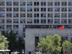 A Chinese flag flutters at the Chinese Ministry of Commerce building in Beijing, China. 