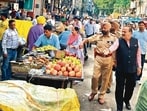 Senior deputy mayor Rakesh Parashar with cops during an anti-encroachment drive in Chaura Bazar on Wednesday. (HT Photo) Senior deputy mayor Rakesh Parashar with cops during an anti-encroachment drive in Chaura Bazar on Wednesday. (HT Photo)