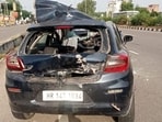 The mangled remains of the car that rammed into a parked truck on Wednesday (HT Photo) The mangled remains of the car that rammed into a parked truck on Wednesday (HT Photo)