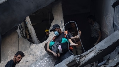 People evacuate the wounded from a building destroyed in an Israeli bombardment in Khan Younis, Gaza Strip. (Fatima Shbair/AP) People evacuate the wounded from a building destroyed in an Israeli bombardment in Khan Younis, Gaza Strip. (Fatima Shbair/AP)