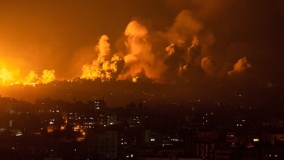 Fire and smoke rise following an Israeli airstrike in Gaza City. (Fatima Shbair/AP) Fire and smoke rise following an Israeli airstrike in Gaza City. (Fatima Shbair/AP)