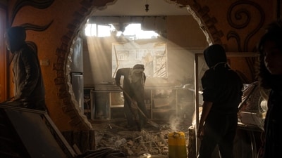 People look at their neighbor's damaged house following an Israeli strike in Rafah, southern Gaza Strip. (Fatima Shbair/AP) People look at their neighbor's damaged house following an Israeli strike in Rafah, southern Gaza Strip. (Fatima Shbair/AP)