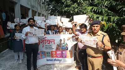 In Sitapur, police officials and administrative officials participating in an awareness programme at a girls college on Thursday. (HT Photo) In Sitapur, police officials and administrative officials participating in an awareness programme at a girls college on Thursday. (HT Photo)