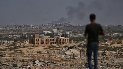 Smoke rises following an Israeli military strike in Gaza City as seen from the central Gaza Strip (AP) Smoke rises following an Israeli military strike in Gaza City as seen from the central Gaza Strip (AP)