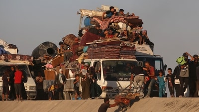 Since October 2023, around 1.9 million Gazans have been displaced due to Israel's bombardment of the Palestinian territory. In this photo, displaced Palestinians are seen moving with their belongings in the Nuseirat refugee camp area after Israel expanded its military offensive. (AFP) Since October 2023, around 1.9 million Gazans have been displaced due to Israel's bombardment of the Palestinian territory. In this photo, displaced Palestinians are seen moving with their belongings in the Nuseirat refugee camp area after Israel expanded its military offensive. (AFP)