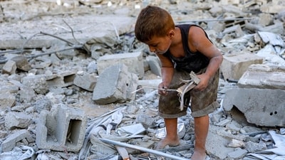A boy searches for scraps of wood to be used for firewood in the rubble in the aftermath of an Israeli strike on Salam Tower in Gaza City. Each day of the war, Israel has only intensified its bombardment of Gaza as part of its ‘war goals’ (AFP) A boy searches for scraps of wood to be used for firewood in the rubble in the aftermath of an Israeli strike on Salam Tower in Gaza City. Each day of the war, Israel has only intensified its bombardment of Gaza as part of its ‘war goals’ (AFP)