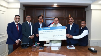 Chief Minister Pushkar Singh Dhami receiving a  ₹5 crore cheque for the Chief Minister’s Relief Fund from representatives of Larsen & Toubro in New Delhi.
