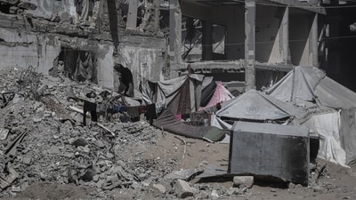 Tent shelters amidst building rubble in Gaza City. The Palestinian territory has been left in ruins due to continuos Isralei bombardment since October 7, 2023. (Bloomberg) Tent shelters amidst building rubble in Gaza City. The Palestinian territory has been left in ruins due to continuos Isralei bombardment since October 7, 2023. (Bloomberg)