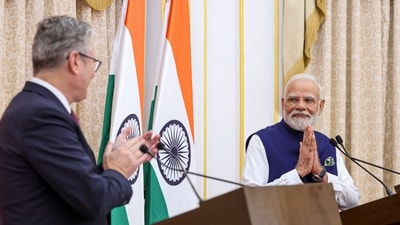 UK PM Keir Starmer clap for PM Modi during a joint press conference after a meeting, in Mumbai. (PMO via PTI) UK PM Keir Starmer clap for PM Modi during a joint press conference after a meeting, in Mumbai. (PMO via PTI)