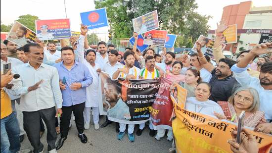 Members of the Congress party took out a candle march near Ambedkar Chowk in Karnal, in view of the “atrocities and injustice” against the Dalit community including the suicidal death of IPS officer Y Puran Kumar. (HT Photo)