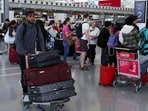 A passenger pushes luggage at Toronto Pearson International Airport, in Mississauga, Ontario, Canada. (REUTERS) A passenger pushes luggage at Toronto Pearson International Airport, in Mississauga, Ontario, Canada. (REUTERS)