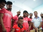 Indian hockey players playing chess on Friday. (HT)