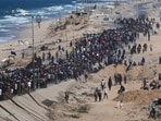 Displaced Palestinians walk toward northern Gaza after Israel and Hamas agreed to a pause in their war and the release of the remaining hostages. Displaced Palestinians walk toward northern Gaza after Israel and Hamas agreed to a pause in their war and the release of the remaining hostages.