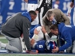 Trainers check on New York Giants quarterback Jaxson Dart (6) after an injury against the Philadelphia Eagles