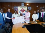 Chief Minister Pushkar Singh Dhami presents financial assistance cheques to the families of UPNL employees who died in road accidents. Chief Minister Pushkar Singh Dhami presents financial assistance cheques to the families of UPNL employees who died in road accidents.