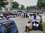 Employees at a shopping mall gather outside the building in Davao City after the earthquake.