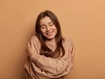Hug yourself to feel the strain release from your body. 