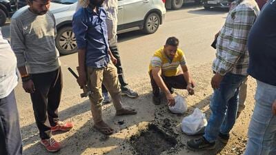 A government official team take the sample of sector-9 road near Basai flyover on Friday. (HT) A government official team take the sample of sector-9 road near Basai flyover on Friday. (HT)