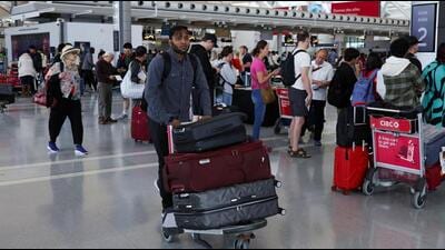 A passenger pushes luggage at Toronto Pearson International Airport, in Mississauga, Ontario, Canada. (REUTERS) A passenger pushes luggage at Toronto Pearson International Airport, in Mississauga, Ontario, Canada. (REUTERS)
