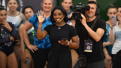 US Olympic gymnast Simone Biles said she will be involved in the Games in some way, though she is unsure whether it will be as a competitor or a spectator. (AFP) US Olympic gymnast Simone Biles said she will be involved in the Games in some way, though she is unsure whether it will be as a competitor or a spectator. (AFP)