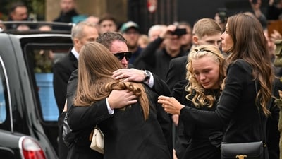 Family members shared emotional embraces outside Manchester Cathedral during the funeral of the late British boxing legend Ricky Hatton. (Photo by Oli SCARFF / AFP) (AFP) Family members shared emotional embraces outside Manchester Cathedral during the funeral of the late British boxing legend Ricky Hatton. (Photo by Oli SCARFF / AFP) (AFP)
