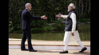 Canada's Prime Minister Mark Carney, left, and India's Prime Minister Narendra Modi reach to shake hands as Carney officially welcomes him to the G7 Summit in Kananaskis, Alberta, June 17, 2025. (AP) Canada's Prime Minister Mark Carney, left, and India's Prime Minister Narendra Modi reach to shake hands as Carney officially welcomes him to the G7 Summit in Kananaskis, Alberta, June 17, 2025. (AP)