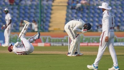 India's captain Shubman Gill (R) reacts after a collision with West Indies' Tevin Imlach during the first day of the second Test. (PTI) India's captain Shubman Gill (R) reacts after a collision with West Indies' Tevin Imlach during the first day of the second Test. (PTI)