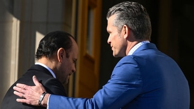 Qatari Defense Minister Sheikh Saoud Al Thani (L) is greeted by Secretary of War Pete Hegseth during a welcoming ceremony at the Pentagon (Getty Images via AFP)